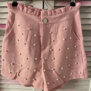 Pink high waisted pearl accent ruffle shorts